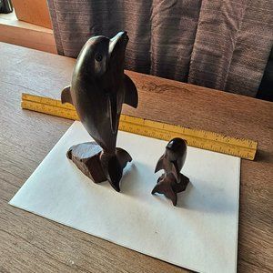 Hand carved wooden dolphins